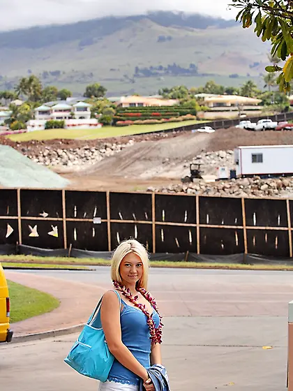 Alison Angel standing on the road and flashes her big boobies an