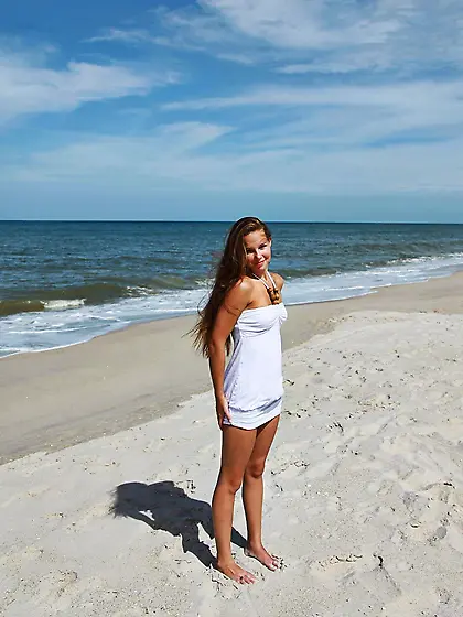 Girl takes off white dress to have fun but friend takes pictures