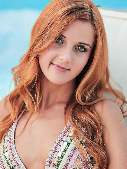 Redhead foxy Roberta Berti takes panty off and approaches nicely