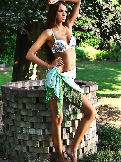 Tanned and leggy babe flashes that ass while teasing the camera