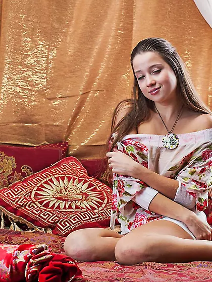 Pretty babe Eva Shanti is showing her flower looking cunt betwee