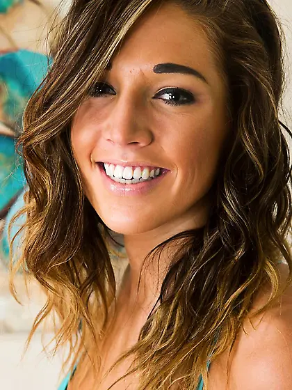 Young handsome Val Midwest shows her shaved taco as she strips o