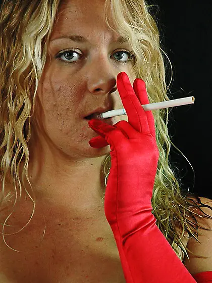 Smoking sexy while her tits exposed