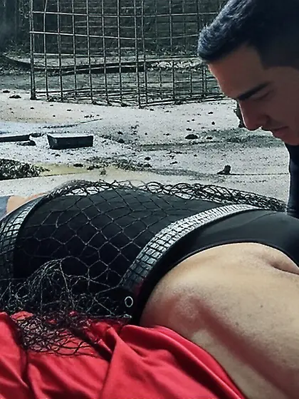 Black Superhero captured in netting.  KO and fondle