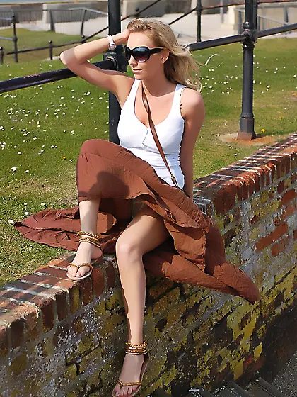 Totally shameless blonde flashing her tits and butt while taking