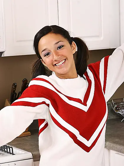 Pigtailed cheerleader Summer Karups with shapely tits and pink p