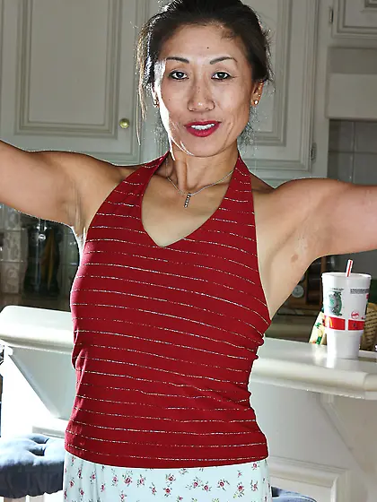 Hot Asian lady shows her bush and looks incredible as well