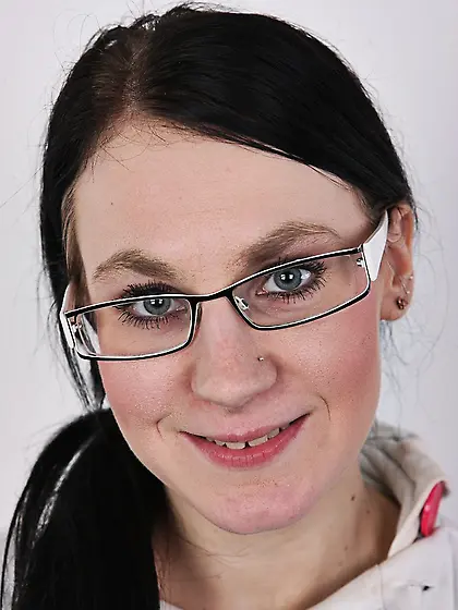 Tattoed girl with eyeglasses hides a deep...