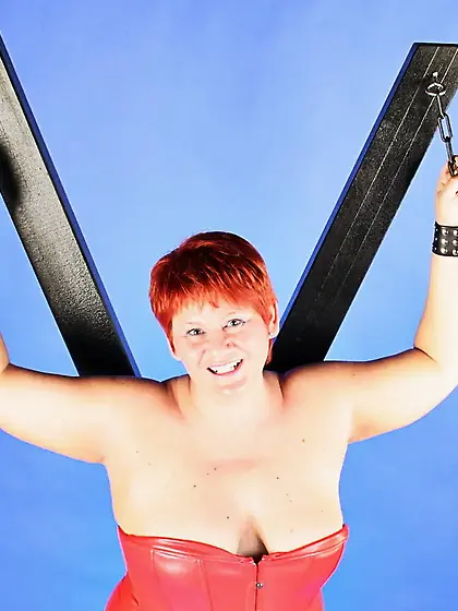 In red fetish outfit