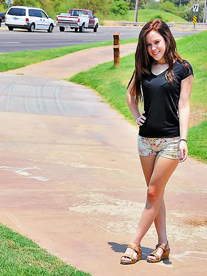 Petite teen brunette Trinity Rae shows off her slit outdoors and