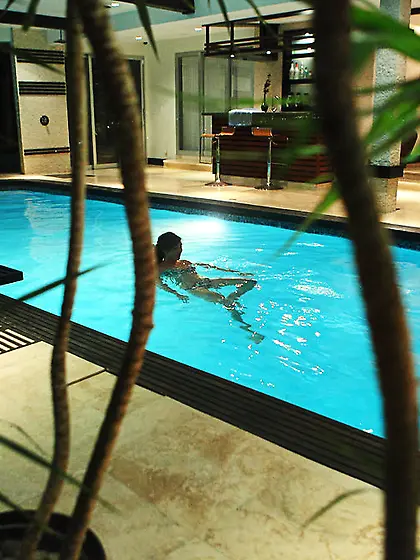 Angelica Saigetakes her bikini in the indoors pool and shows her