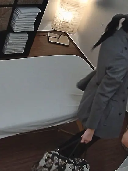 Slender long-legged model undressing