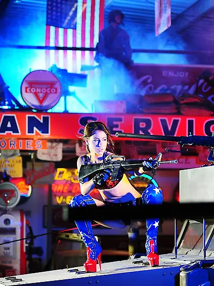 Leggy brunette haired gun babe Carrie Du Four in high blue boots