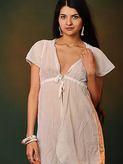 Dark-haired beauty dressed in a see-through outfit shows everyth