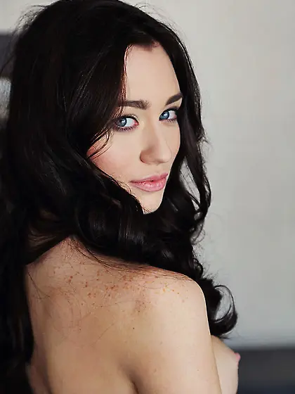 Gorgeous blue-eyed beauty flaunts