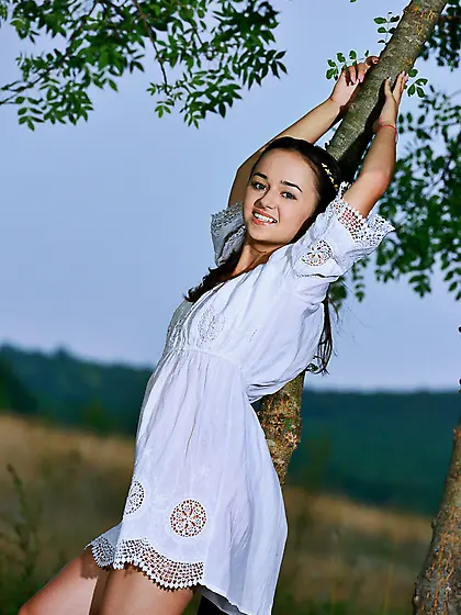 Country girl-esque brunette taking it all and posing outdoors Vi