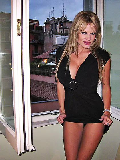 Beautiful and sexy blonde Kelly Madison strips her slutty black