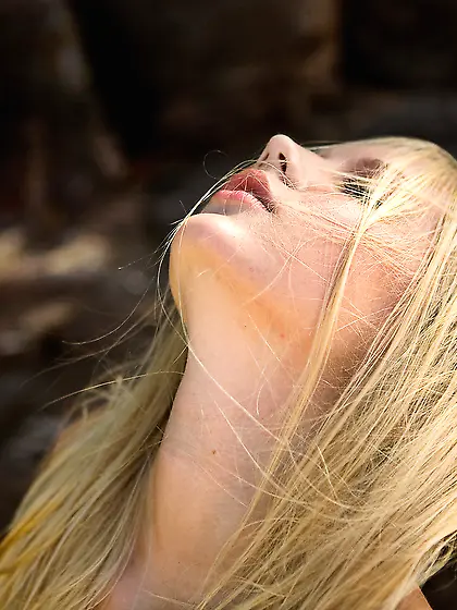 Hot blonde Ekaterina Alekseeva knows how to tease and pose by th