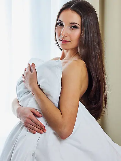 Brunette looks all soft and seductive while teasing you with her