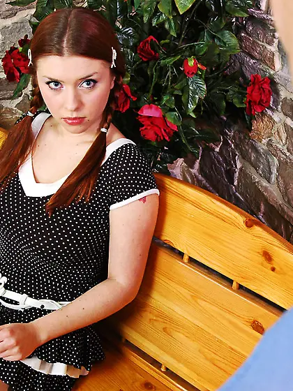 Pigtailed redhead skimpy dress