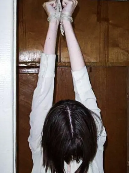 Arms Tied Above Her Head