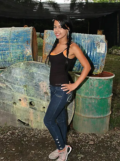 Attractive tanned brunette with hot body Gigi Spice posing in ti