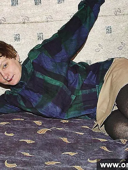 Mature brunette posing naked with a scarf