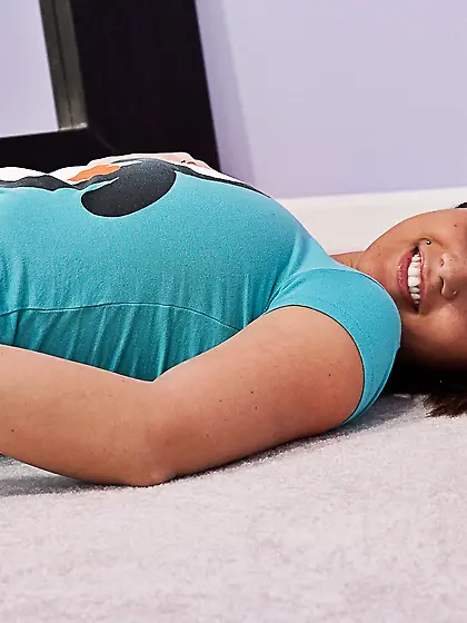 Attractive teen cuttie Nikki Sims strips on the bed and shows us