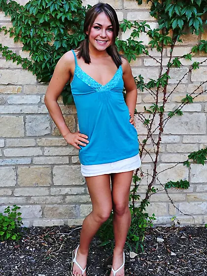 Brunette cutie Taylor Lain removes her outfit in the garden and