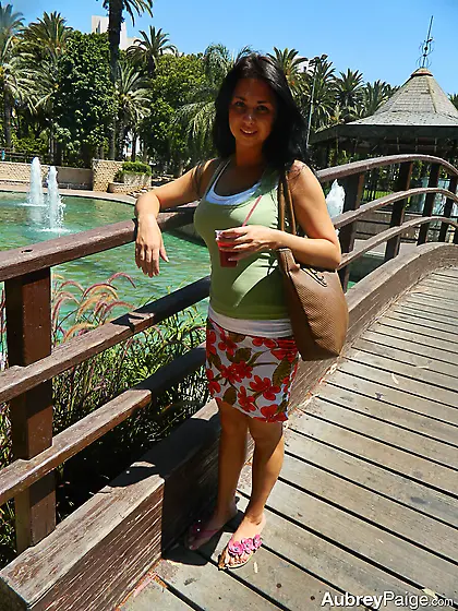 Brunette teen Aubrey Paige drinks juice and exposes her titties