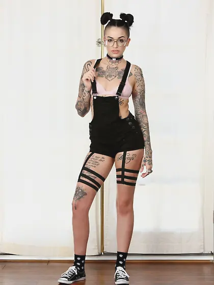 Teen emo has a body almost completely covered with tattoos and s