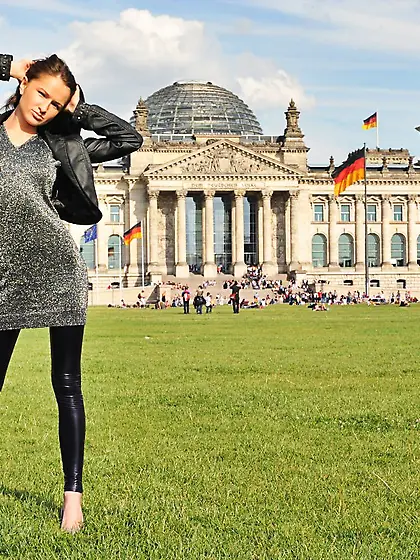 Watch this bombshell strip in front of the Reichstag!