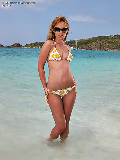 Charming babe Nikita is losing off bikini and masturbating in th