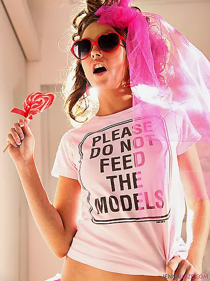 Doll with lollipop Jenna Haze in pink wedding veil displays her