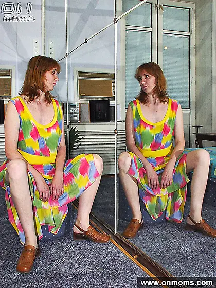 Redhead mature naked posing