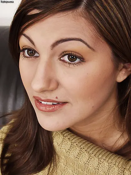 Beautiful brunette gal Tracee strips on the sofa and teases us i