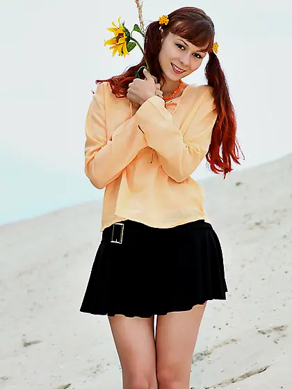 Nude pigtailed redhead