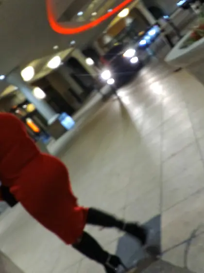 Red dress juicy GILF with phat ass at the casino.