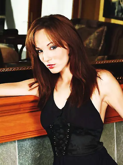 Attractive redhead babe Charlie Laine strips her black dress and