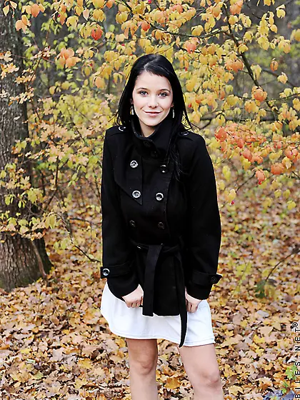 Attractive busty brunette Adrianne Black strips her clothes and