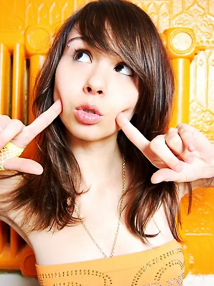 Sexy and beautiful solo babe, Ariel Rebel eating orange and play