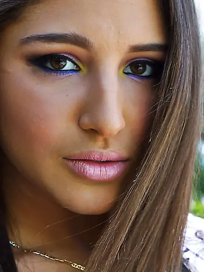 Erotic girl wears purple pants underscoring her tight bottom pul