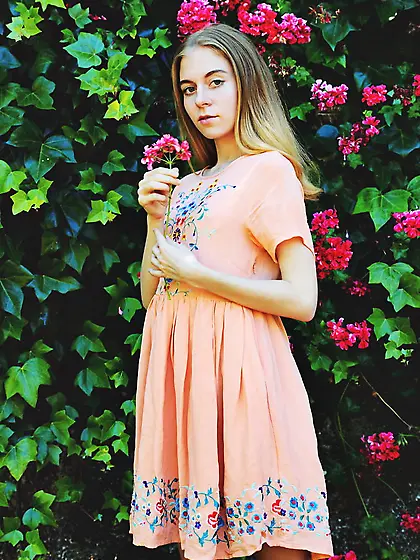 Attractive teen with skinny legs likes to show her body in the g