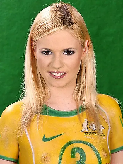 Hot blonde Yasmine Gold painting her body as a soccer player and