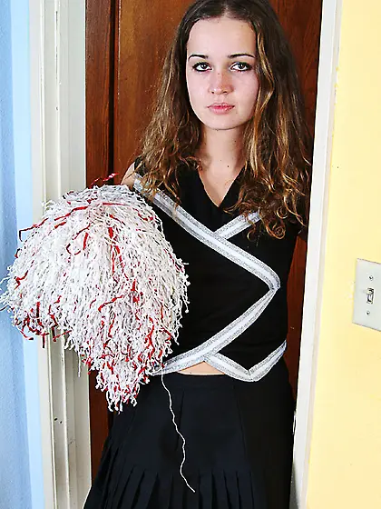 Cheerleader Louisa Rosso pulls down her panties and gives a clos