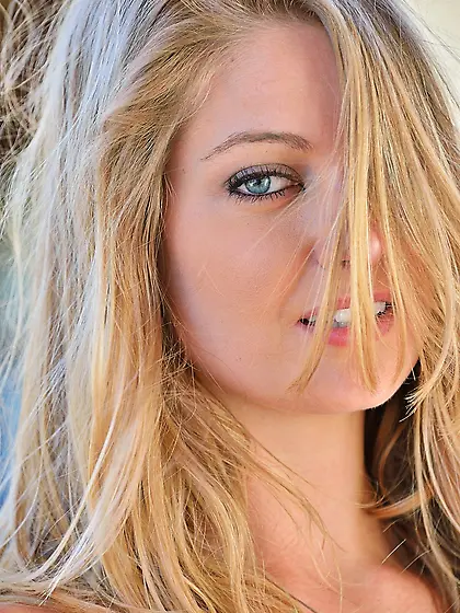 Blond-haired babe exposes her boobs and wet pussy in a hot galle