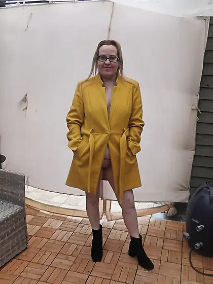 British Wife In coat out in the Yard in the cold