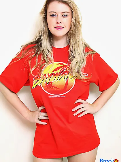 Girl takes her red T-shirt and black shorts off but leaves shoes