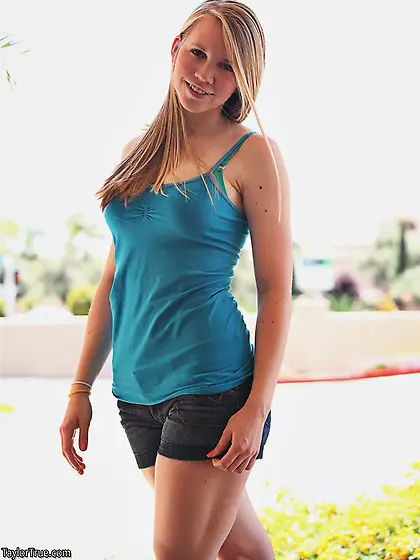 Beautiful teen cuttie Taylor True strips her clothes and shows h