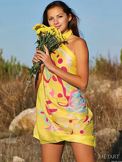 Long-legged and round-breasted lady posing in a hot outdoor gall